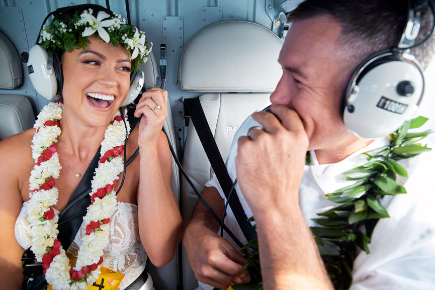 Couple with Lei's inside a Rainbow Helicopter